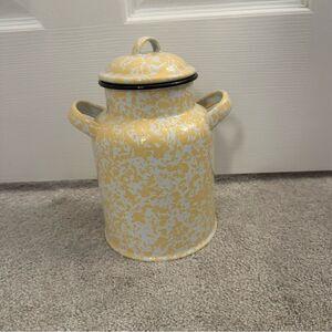 yellow and white enamelware milk can with lid
